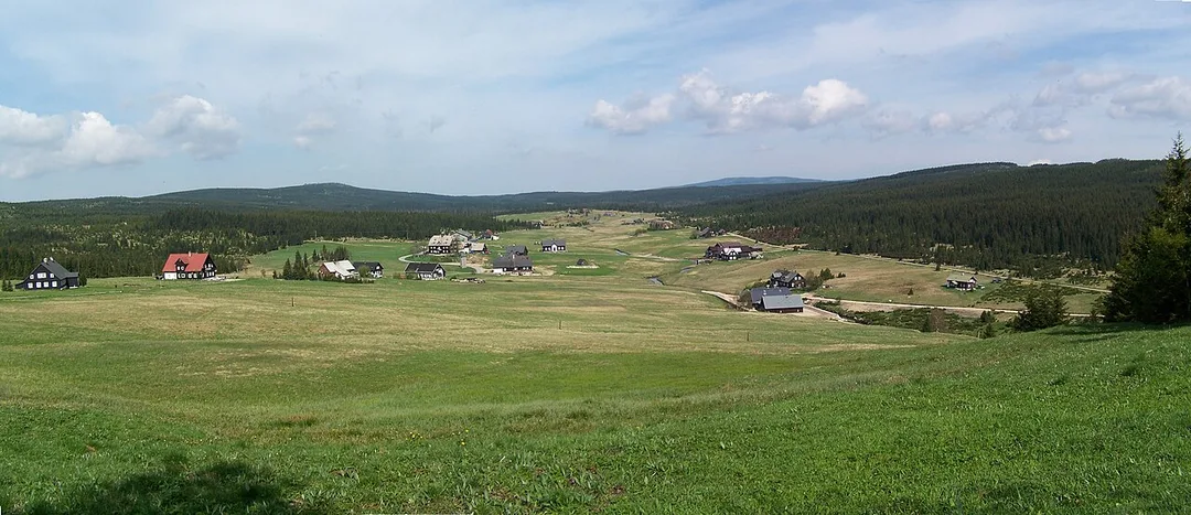 Jizerka, a small mountain village in the Jizera Mountains, seen from the surrounding hills