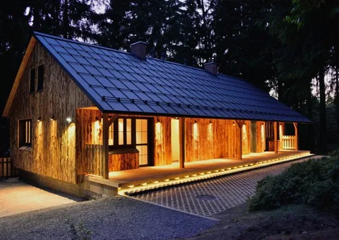 A private forest cottage at Montanie Resort, lit at dusk among the trees
